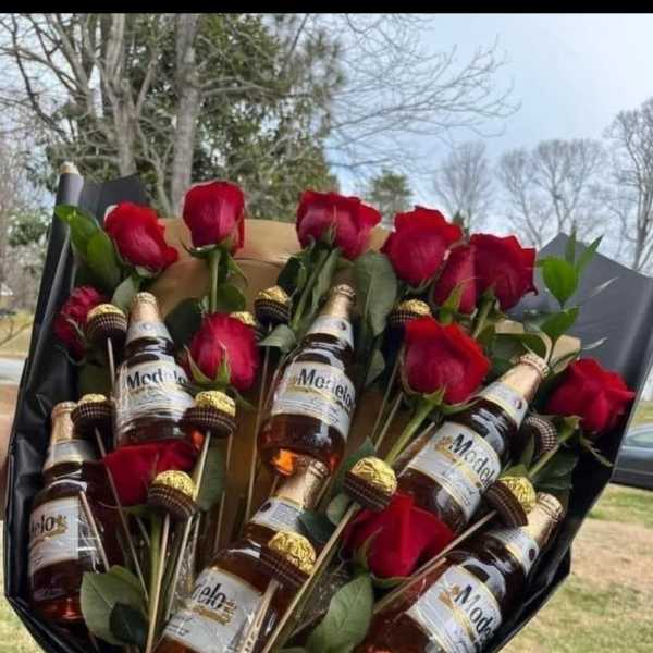 Bouquet of red roses with mini beer bottles and chocolate candies