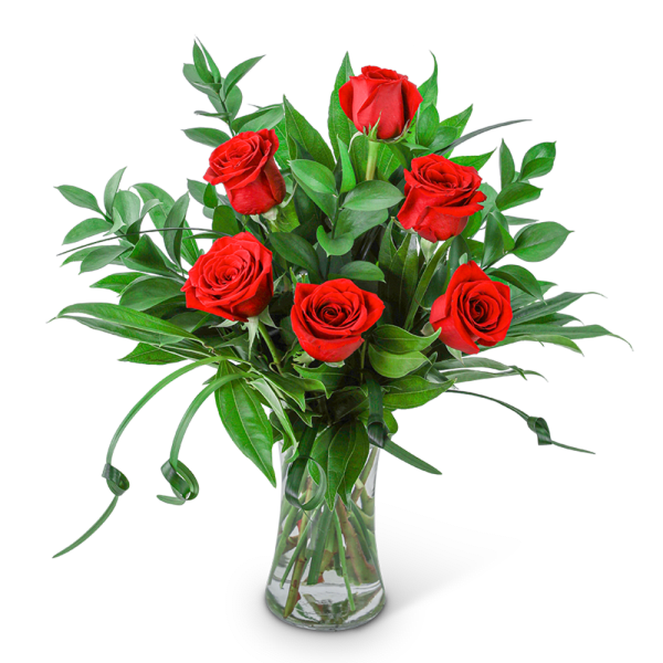 Red roses arranged in a clear glass vase with greenery
