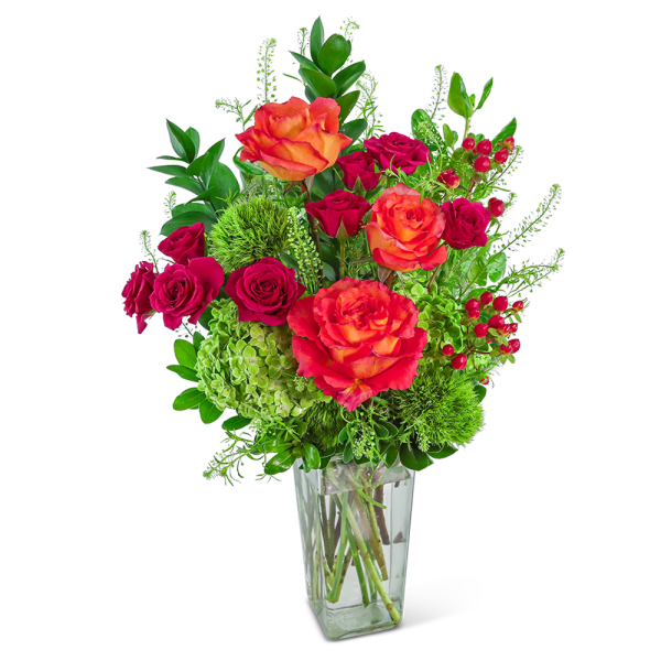 Bouquet of orange and pink roses in a clear glass vase