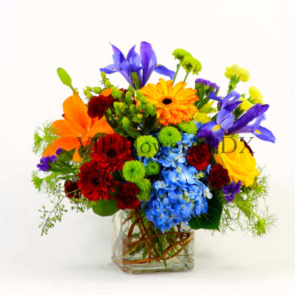 Colorful mixed bouquet in a clear glass vase