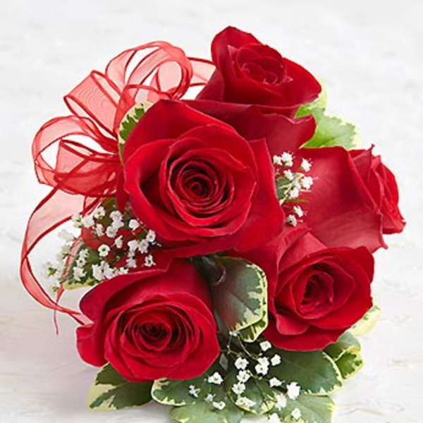 Bouquet of red roses with baby’s breath and a red ribbon