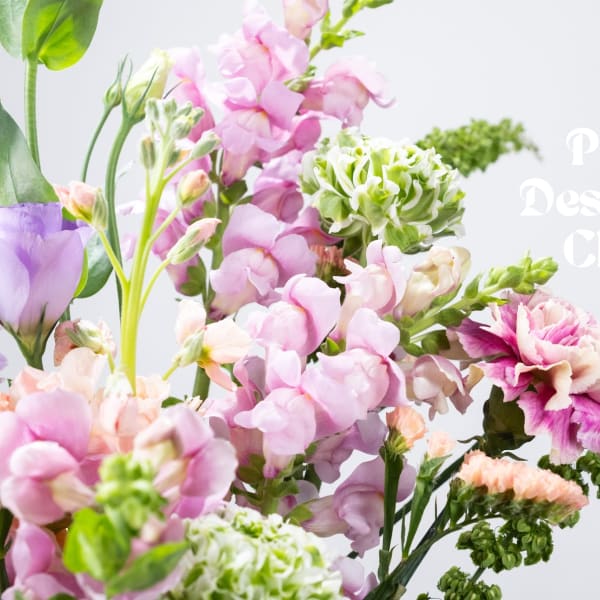 Pastel bouquet with pink, purple, and green flowers