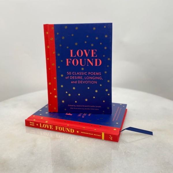 Two stacked books with blue and red covers titled Love Found