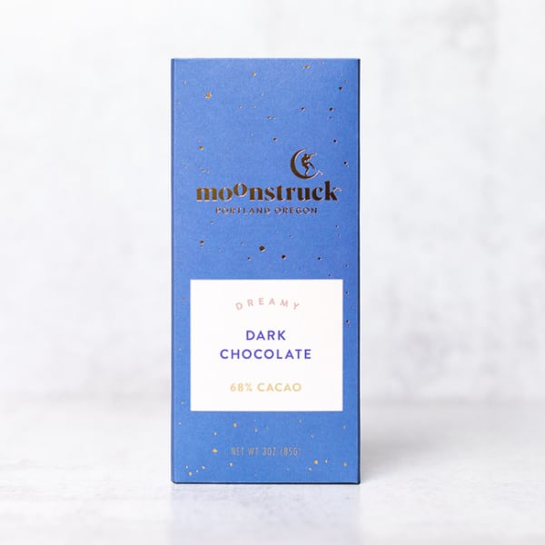 Blue box of dark chocolate with gold speckles