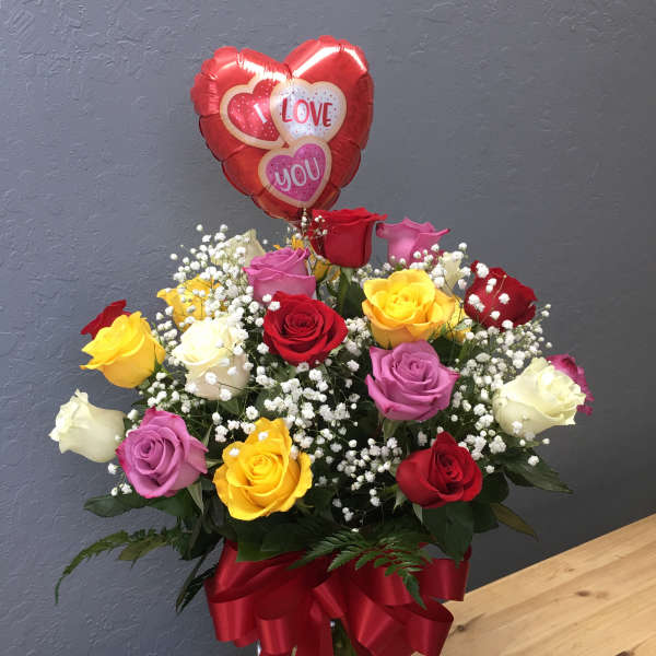 Bouquet of multicolored roses with a heart-shaped "I love you" balloon