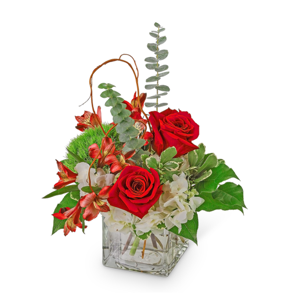 Red roses and white flowers in a square glass vase