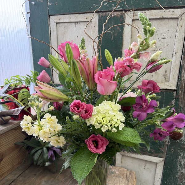 Pink and white mixed bouquet in a clear glass vase