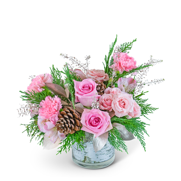 Pink roses and carnations in a glass vase with pinecones