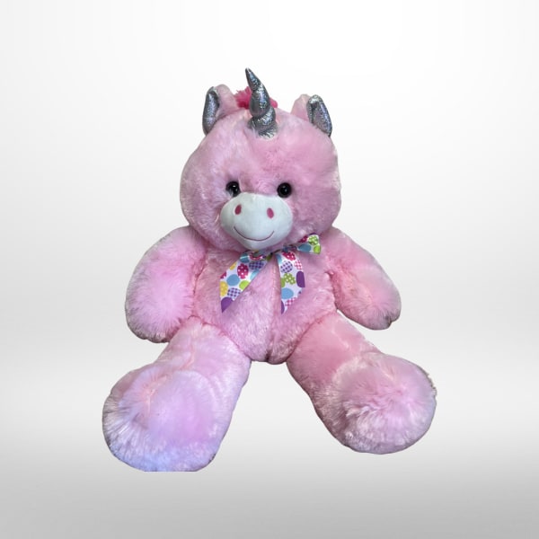 Pink plush unicorn teddy bear with a patterned ribbon bow
