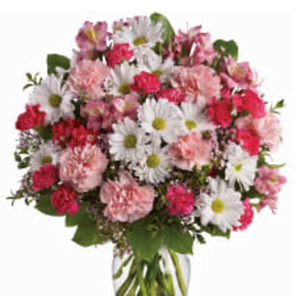 Pink and white mixed bouquet in a clear glass vase