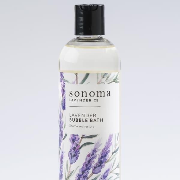 Bottle of lavender bubble bath with illustrated purple lavender sprigs on the label
