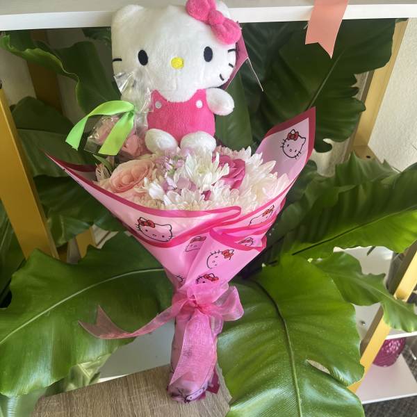 Pink bouquet with a Hello Kitty plush and ribbon wrap