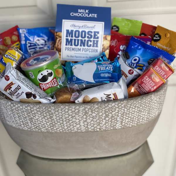 Gift basket filled with assorted snacks and chocolates