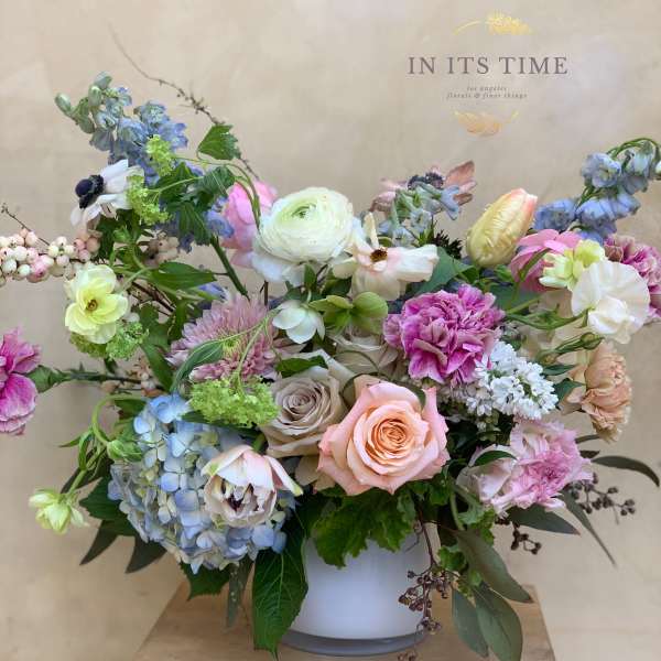 Mixed pastel bouquet in a white vase