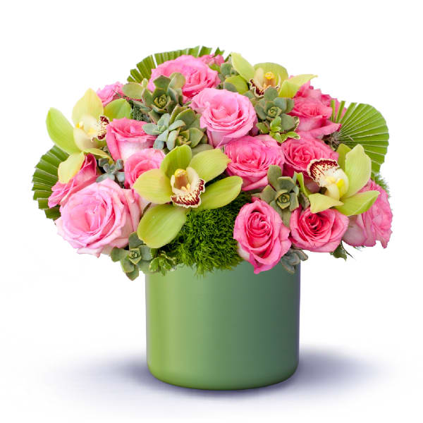 Pink roses and green orchids in a green vase