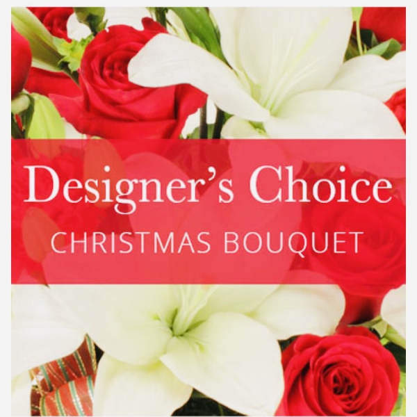 Red roses and white lilies with a Christmas bouquet label