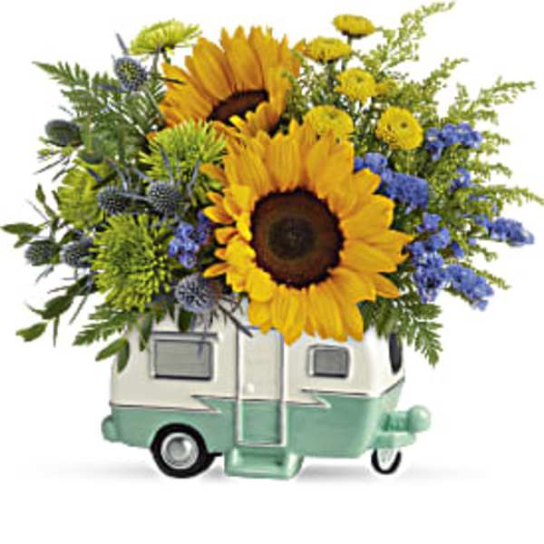 Sunflower arrangement in a small camper-shaped container