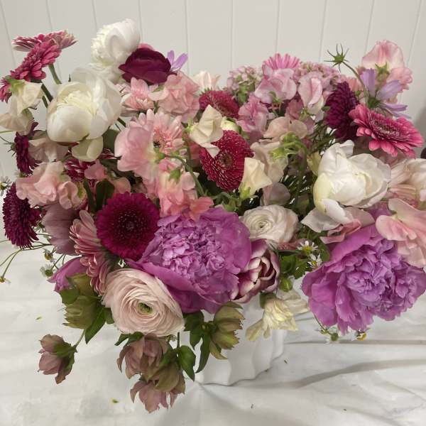 Mixed pink and white bouquet with peonies, ranunculus, and daisies