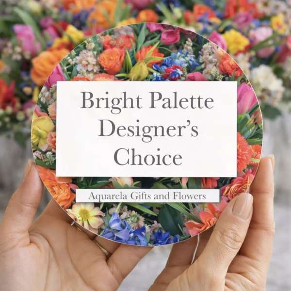 Round card with bright mixed flowers and the text Bright Palette Designer's Choice
