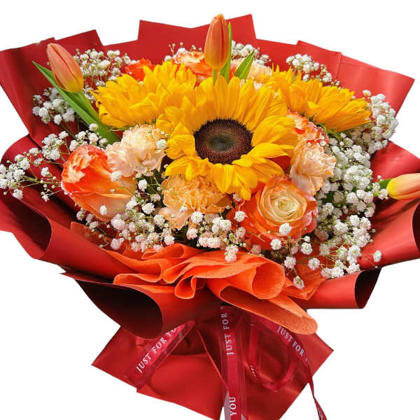 Bouquet of sunflowers, roses, carnations, and tulips wrapped in red paper