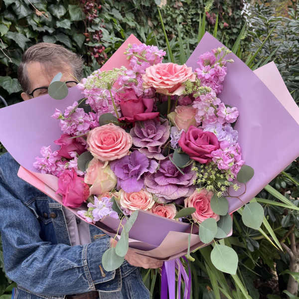 Large pink and purple bouquet with roses and wrapped paper