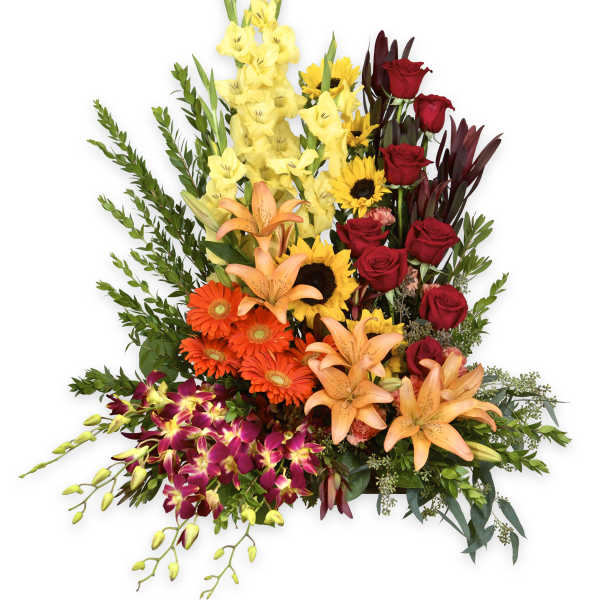 Tall mixed bouquet with red roses, lilies, and sunflowers