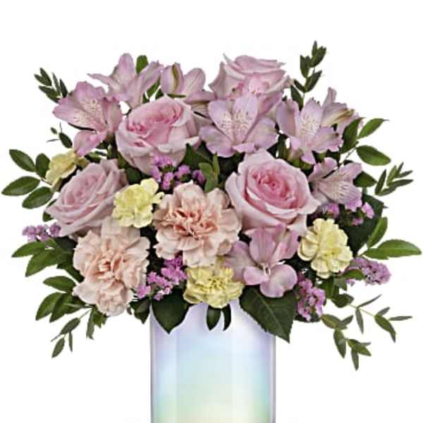 Pink and lavender bouquet in an iridescent glass vase