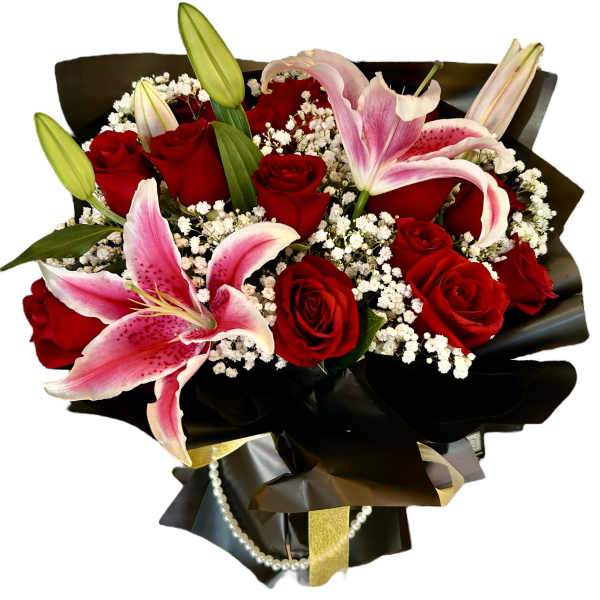 Bouquet of red roses and pink lilies wrapped in black paper