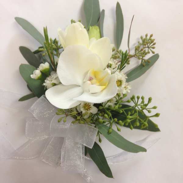 White orchid bouquet with greenery and a sheer ribbon