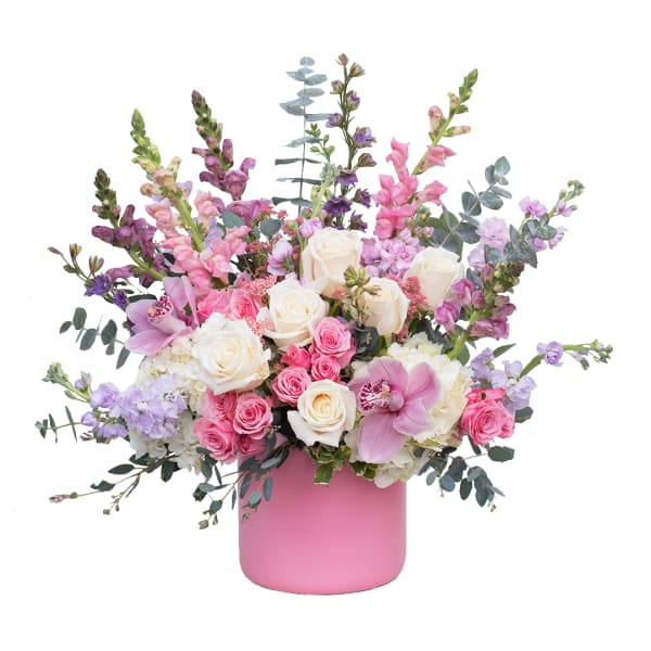 Pink and white mixed flower arrangement in a pink vase