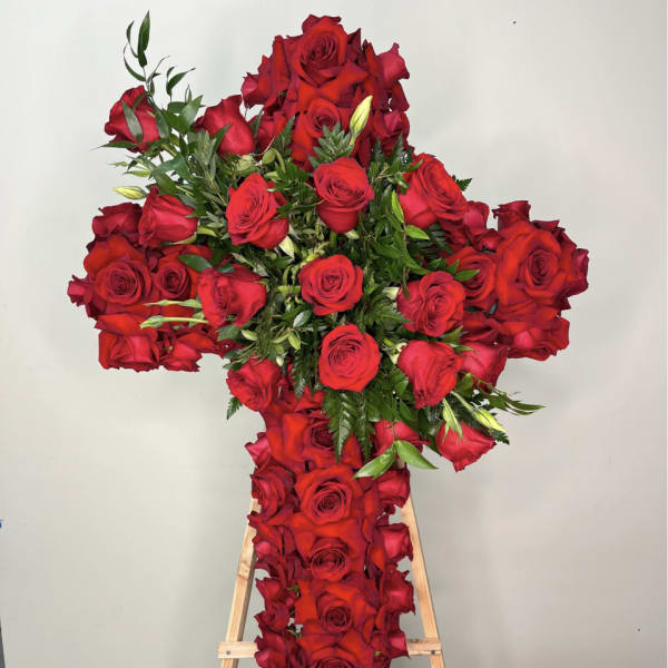 Large red rose cross on a wooden easel