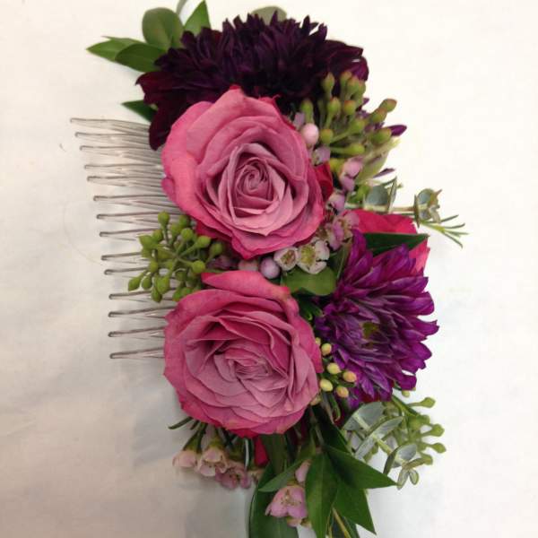 Pink and purple floral hair comb with roses and small blooms