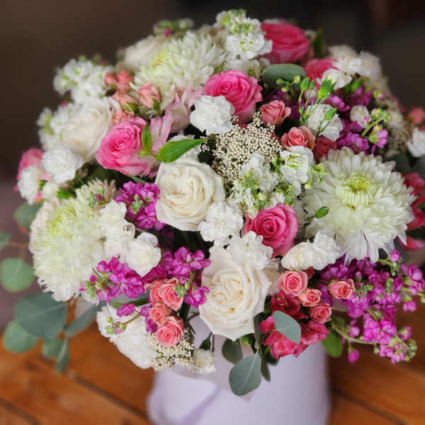 Bouquet of pink and white roses with white chrysanthemums in a vase