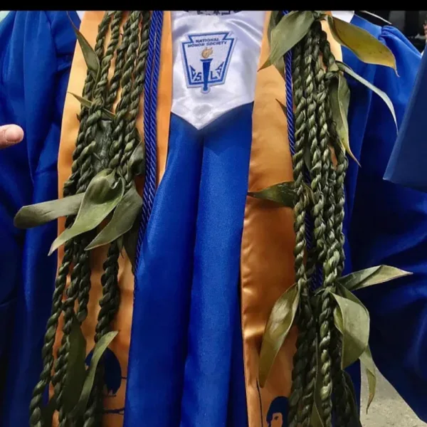 Graduation gown with braided green leis and honor cords