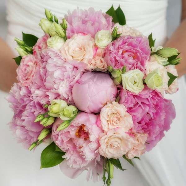 Pink and cream bouquet with peonies, roses, and small buds