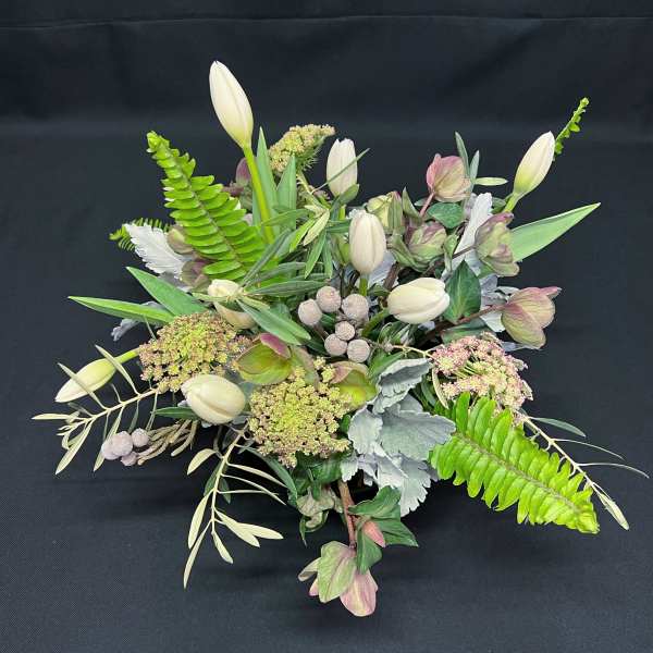 Calming Helebore spring centerpiece with tulips