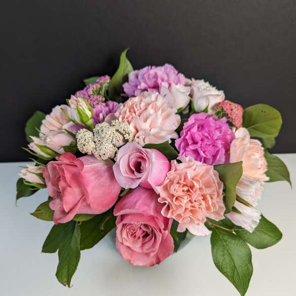 Pink and peach rose bouquet with carnations and small filler flowers