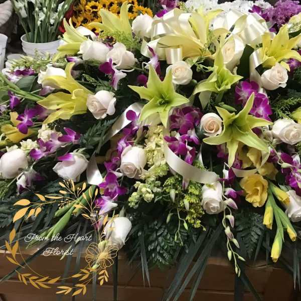 Orchid and Lily casket spray (FC10)