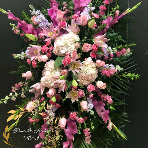 Large pink and white floral standing spray with lilies and roses