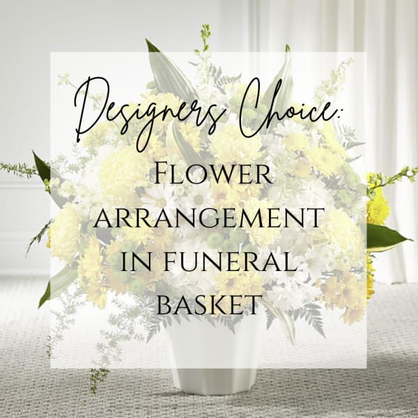 Yellow and white flower arrangement in a white vase