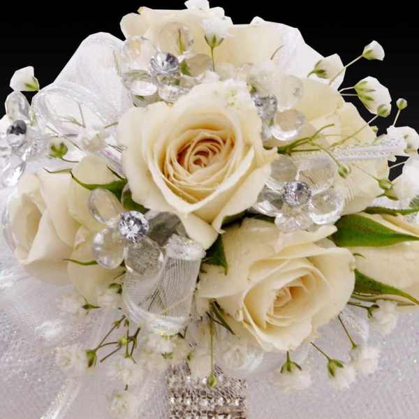 Cream rose bouquet with crystal accents and white ribbon