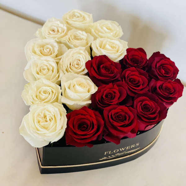 Heart-shaped box of red and white roses