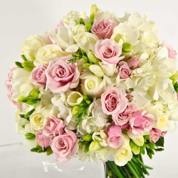 Bouquet of pink and white roses with white orchids