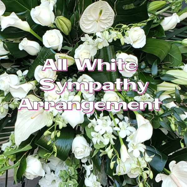 White sympathy floral arrangement with roses, calla lilies, and orchids
