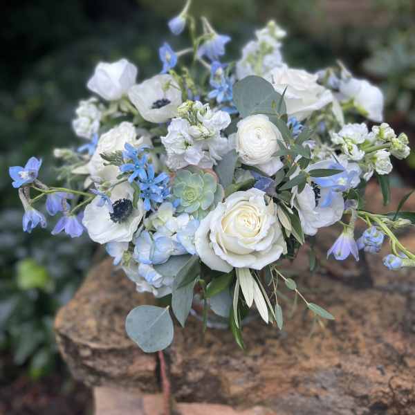 White and blue mixed bouquet with roses and ranunculus
