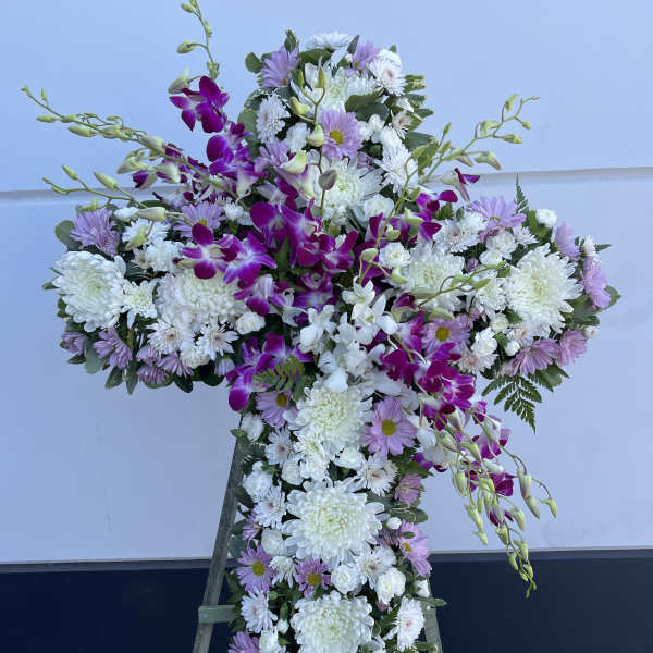 Cross-shaped floral spray with white and lavender blooms and purple orchids