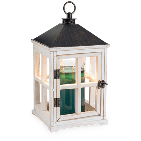 White wooden lantern with a glass candle holder inside