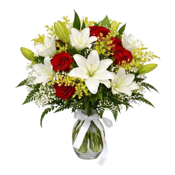 Bouquet of red roses and white lilies in a glass vase