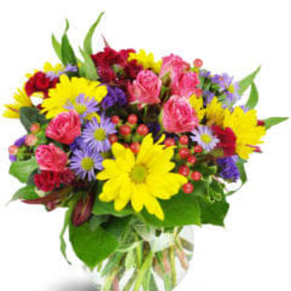 Colorful mixed bouquet in a clear glass vase