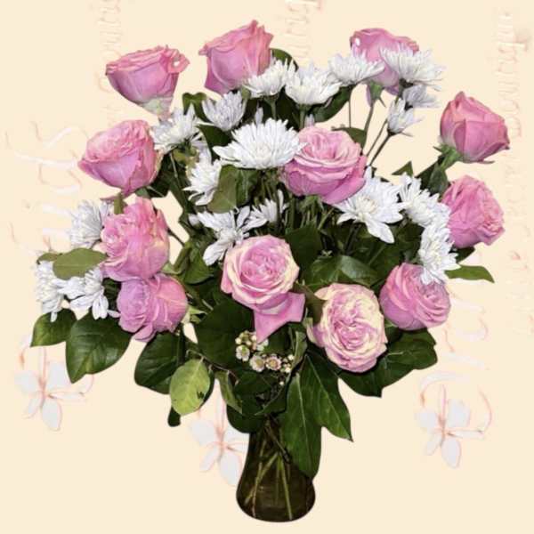 Pink roses and white daisies in a glass vase
